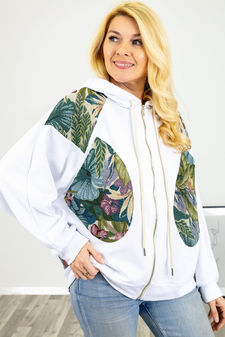 Biała bluza damska Pinasca o luźnym fasonie z dużymi kieszeniami i dekoracyjnym motywem kwiatowym