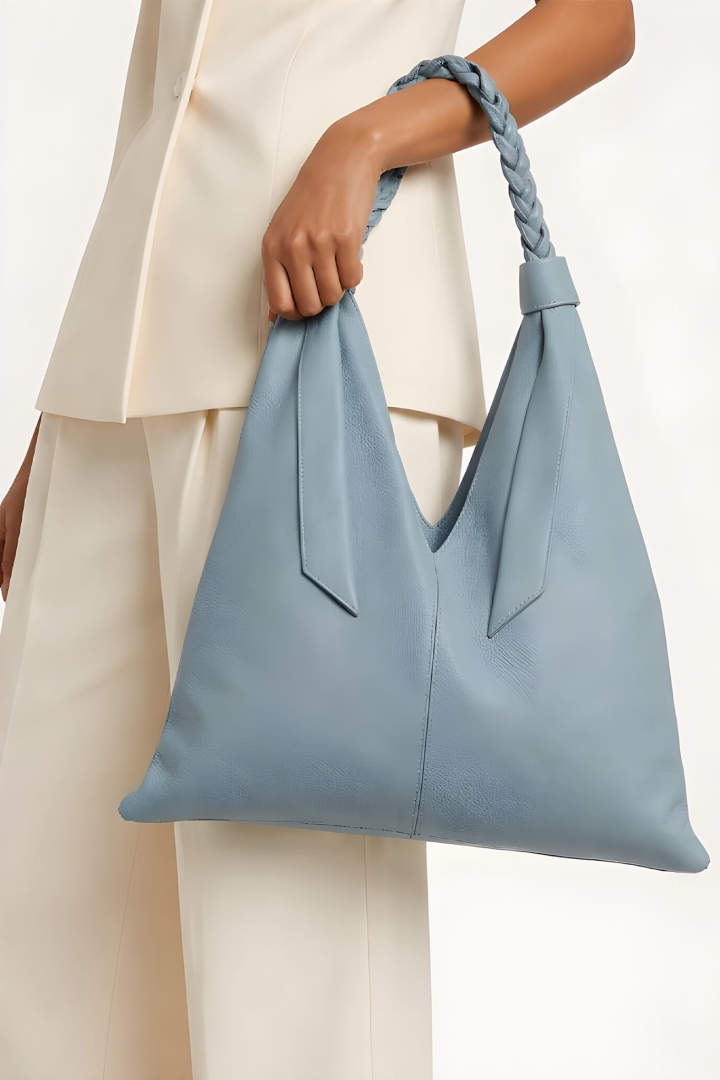 Skórzana torebka worek Puntoni z plecionym uchwytem shopperka w stylu boho błękitna