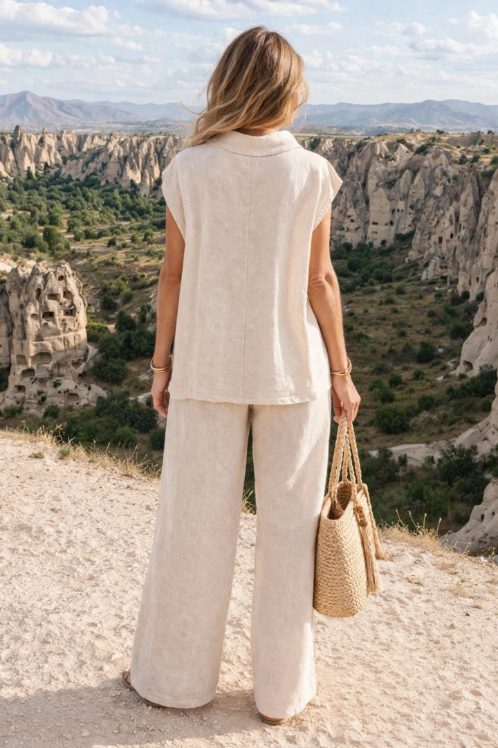 koszula damska lniana beżowa oversize asymetryczna ze strzępionymi falbankami na guziki Frassanito