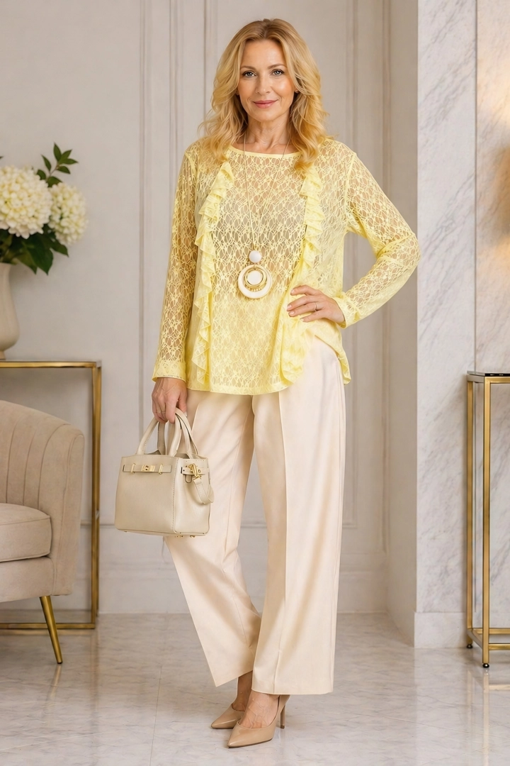 Bluzka koronkowa pastelowo żółta z falbanką okrągły dekolt długi rękaw Chambave