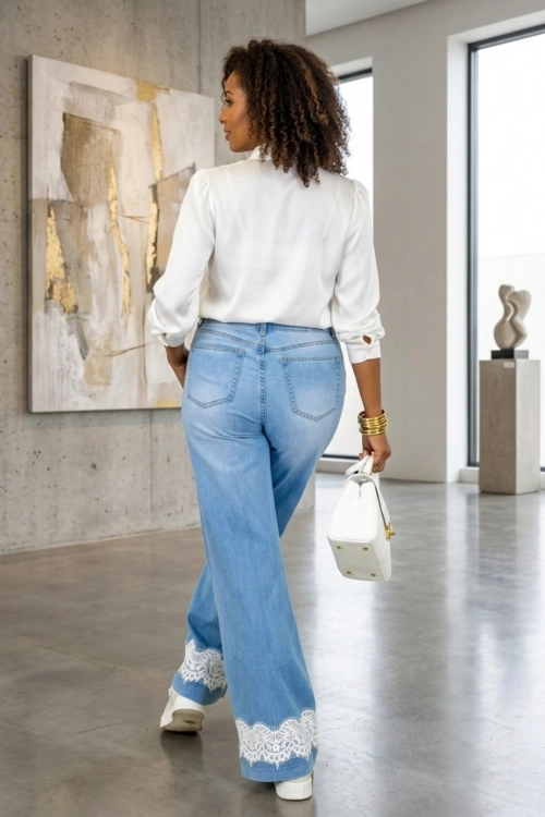 Jeansowe spodnie damskie wide leg jasny denim z dekoracyjną koronką Gorle
